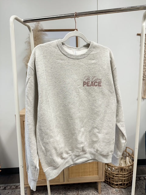 a sweater hanging on a rack in a room