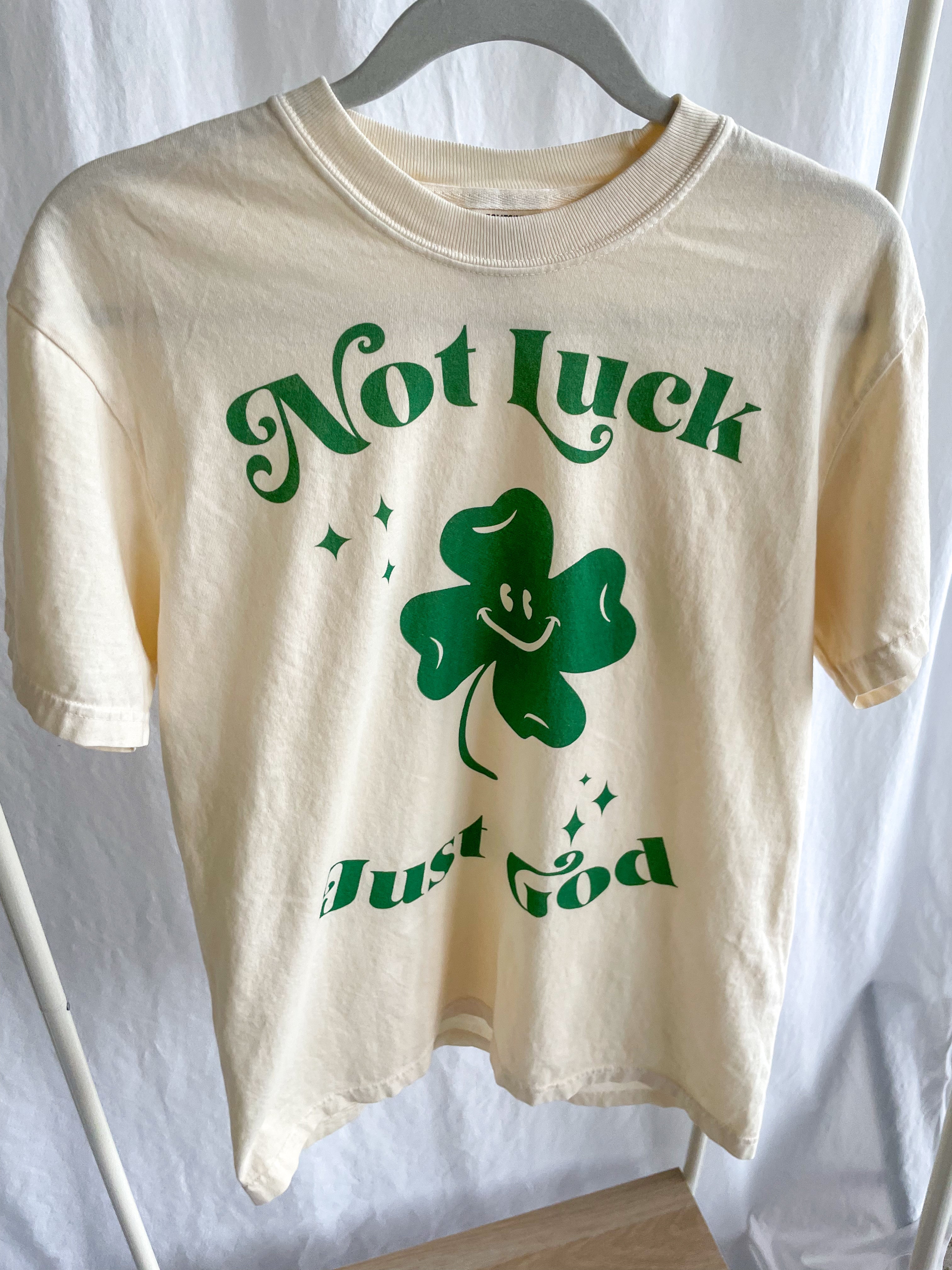 a t - shirt that says not luck but god