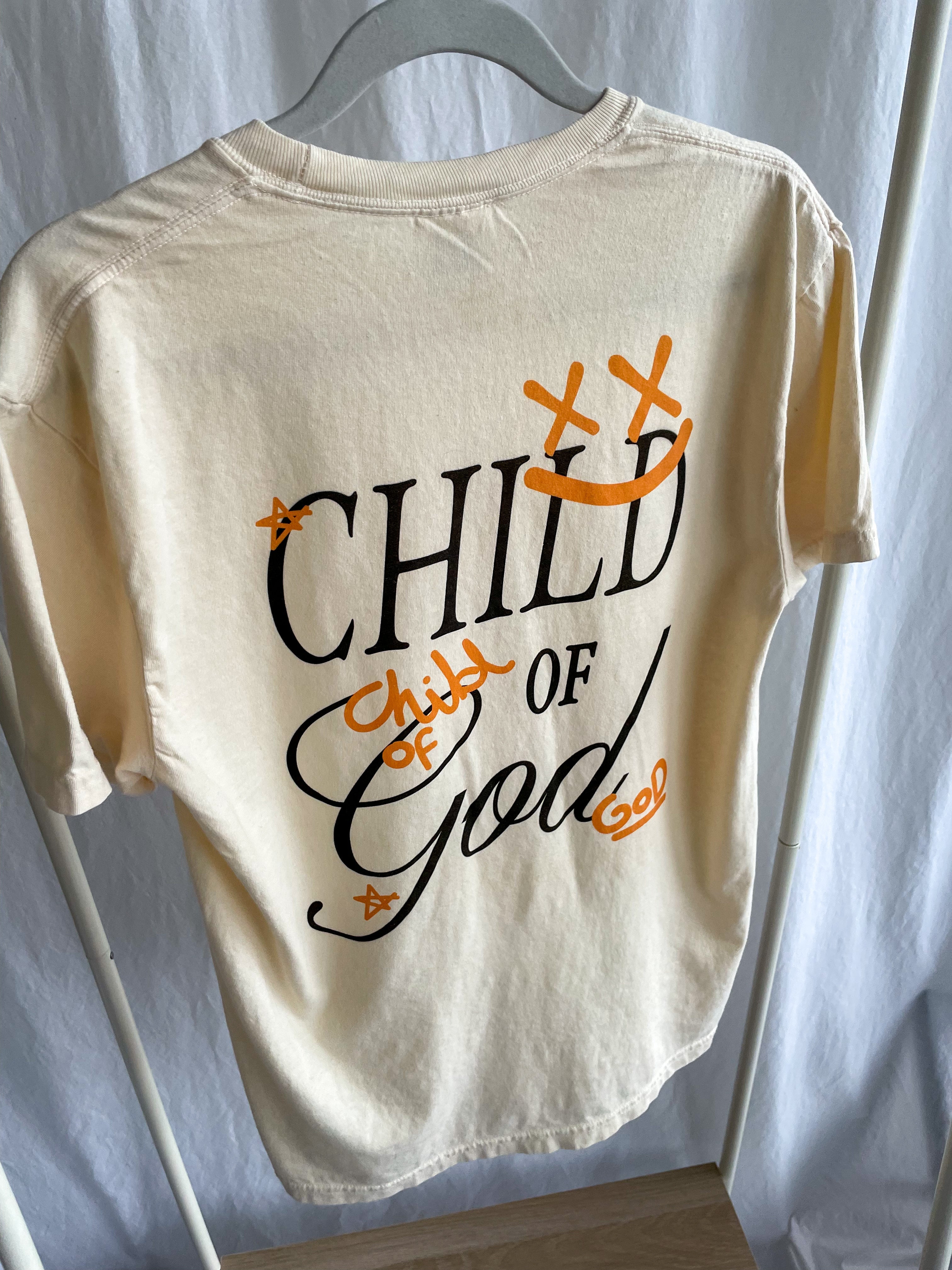 a t - shirt that says child of god on it