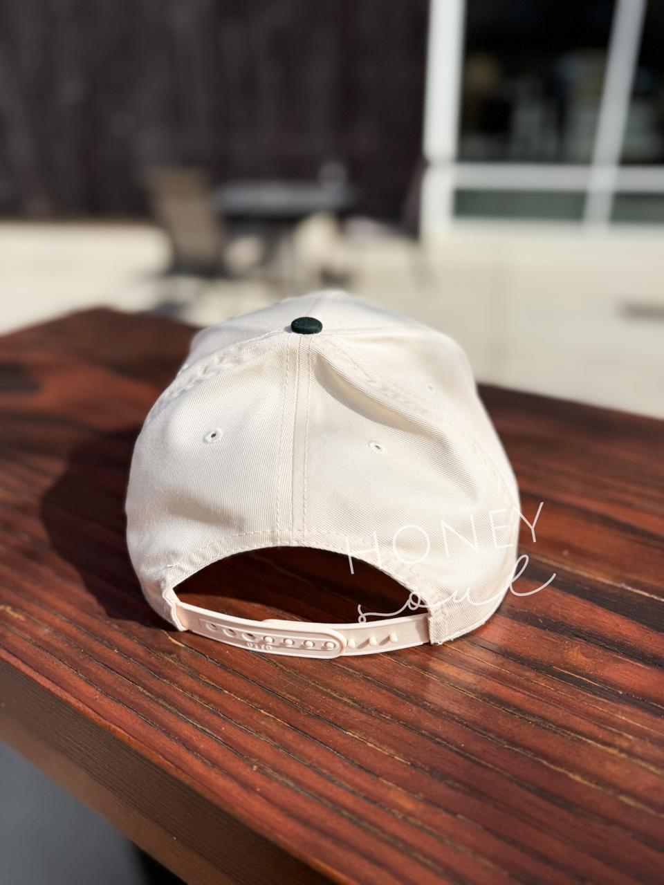 a white hat sitting on top of a wooden table