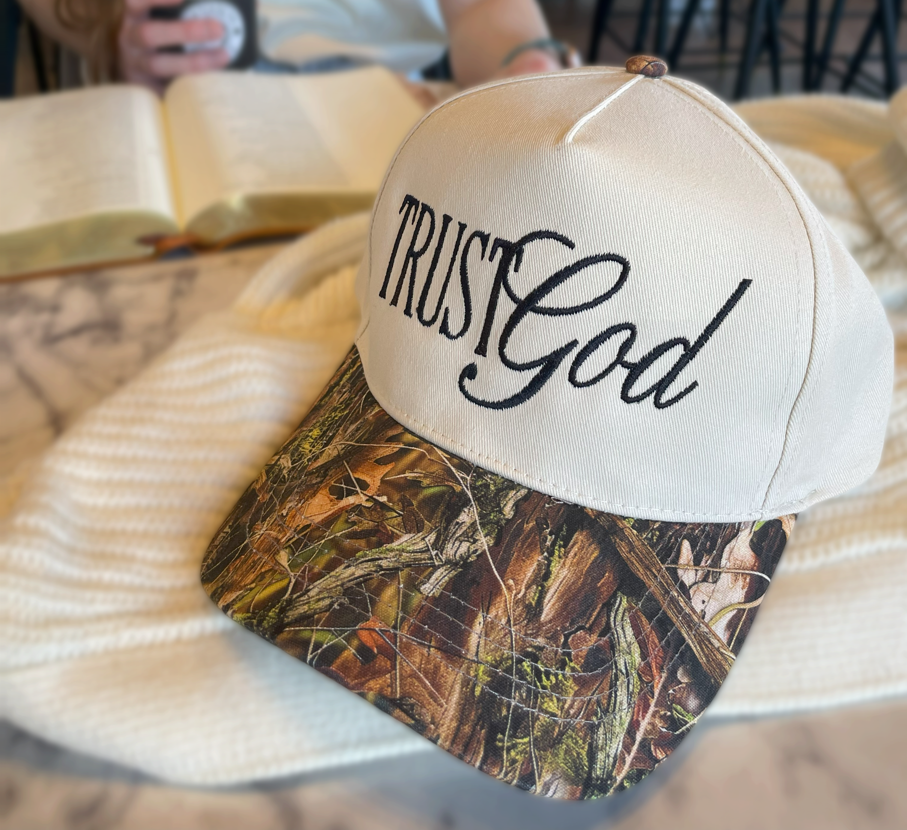 a hat that says trust god on it