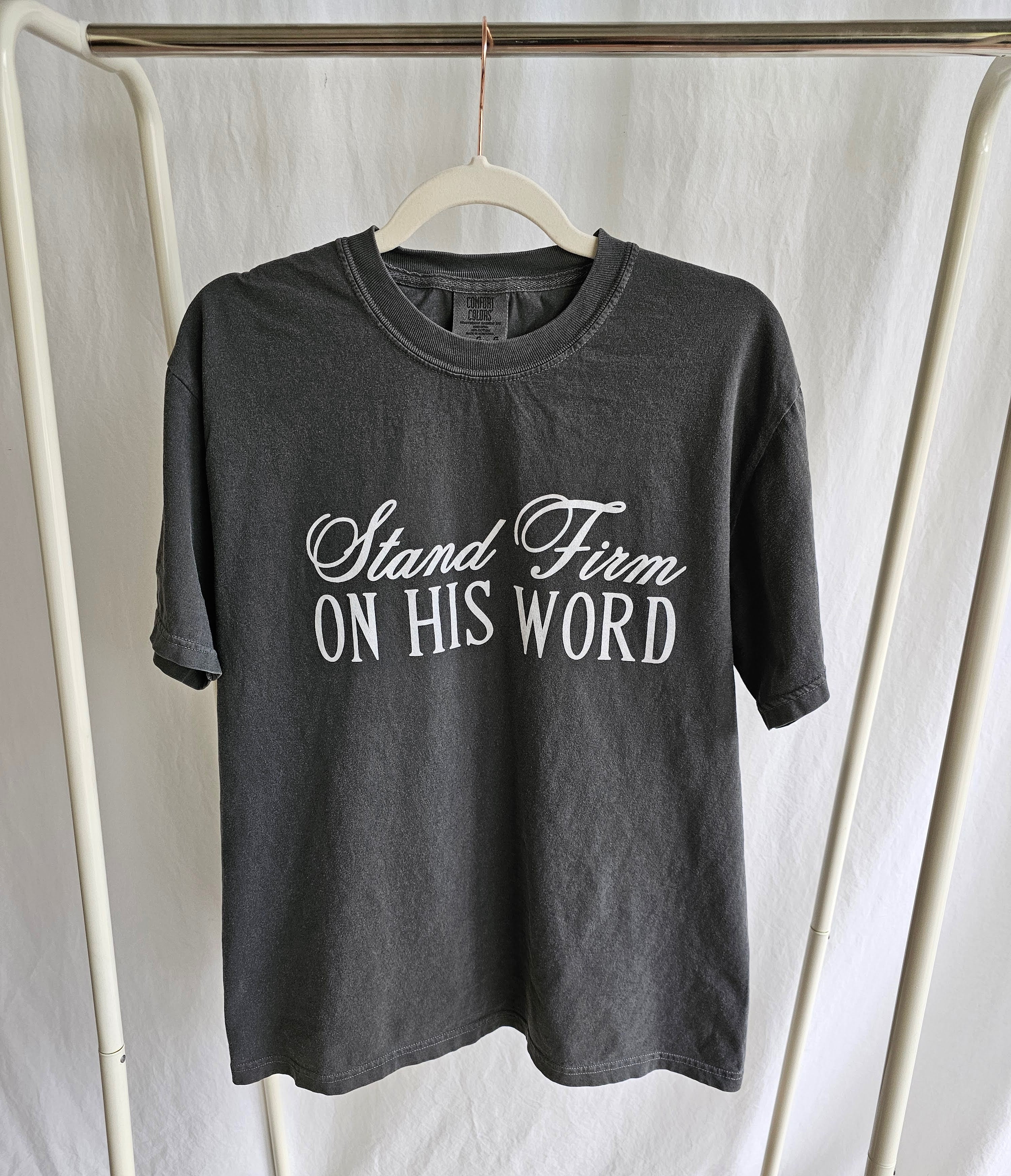 a t - shirt that says stand firm on his word