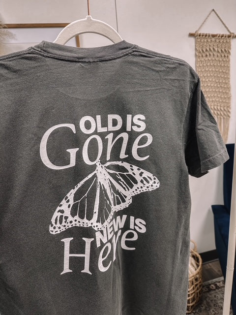 a t - shirt with a picture of a butterfly on it