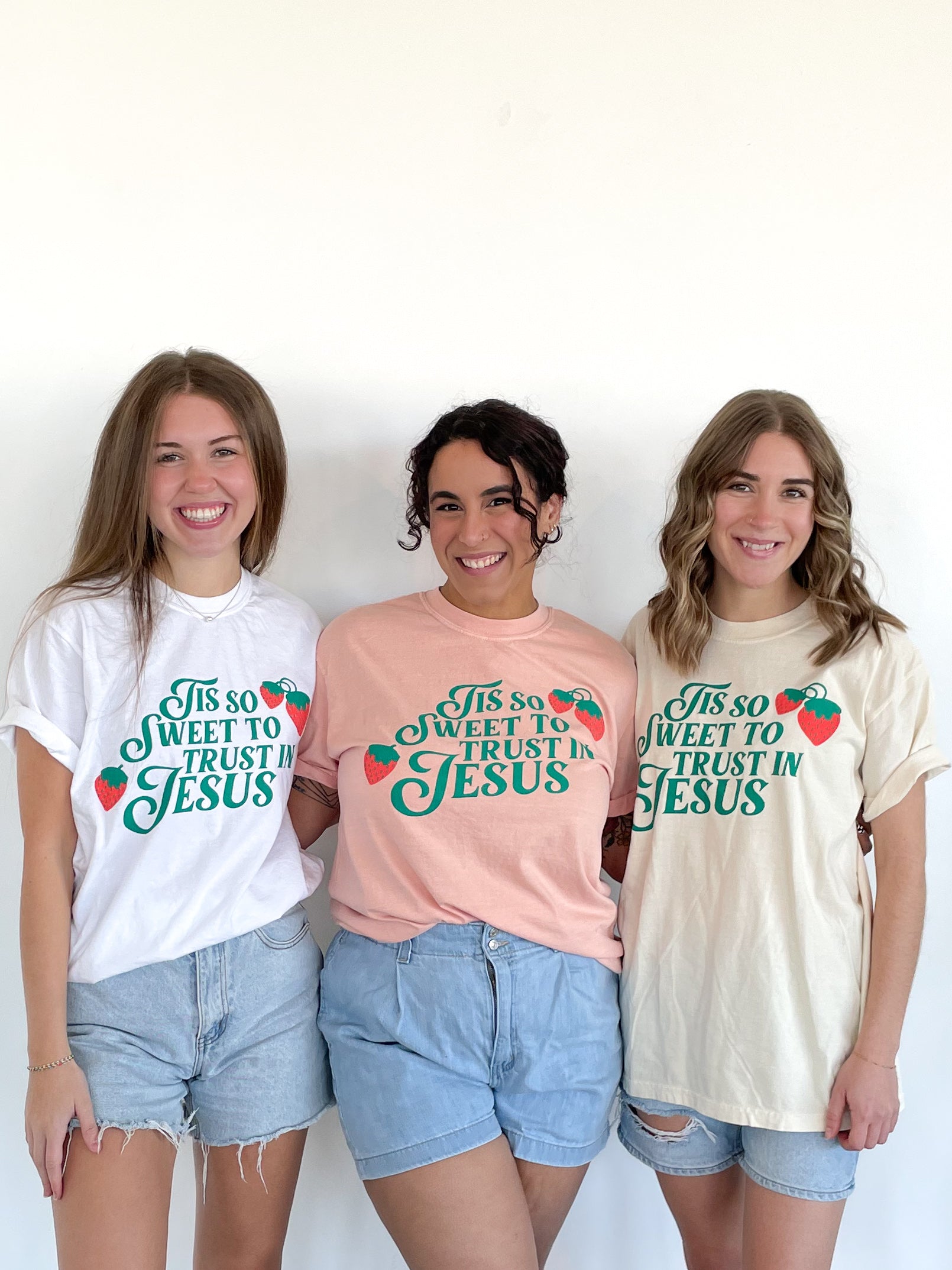 three young women standing next to each other