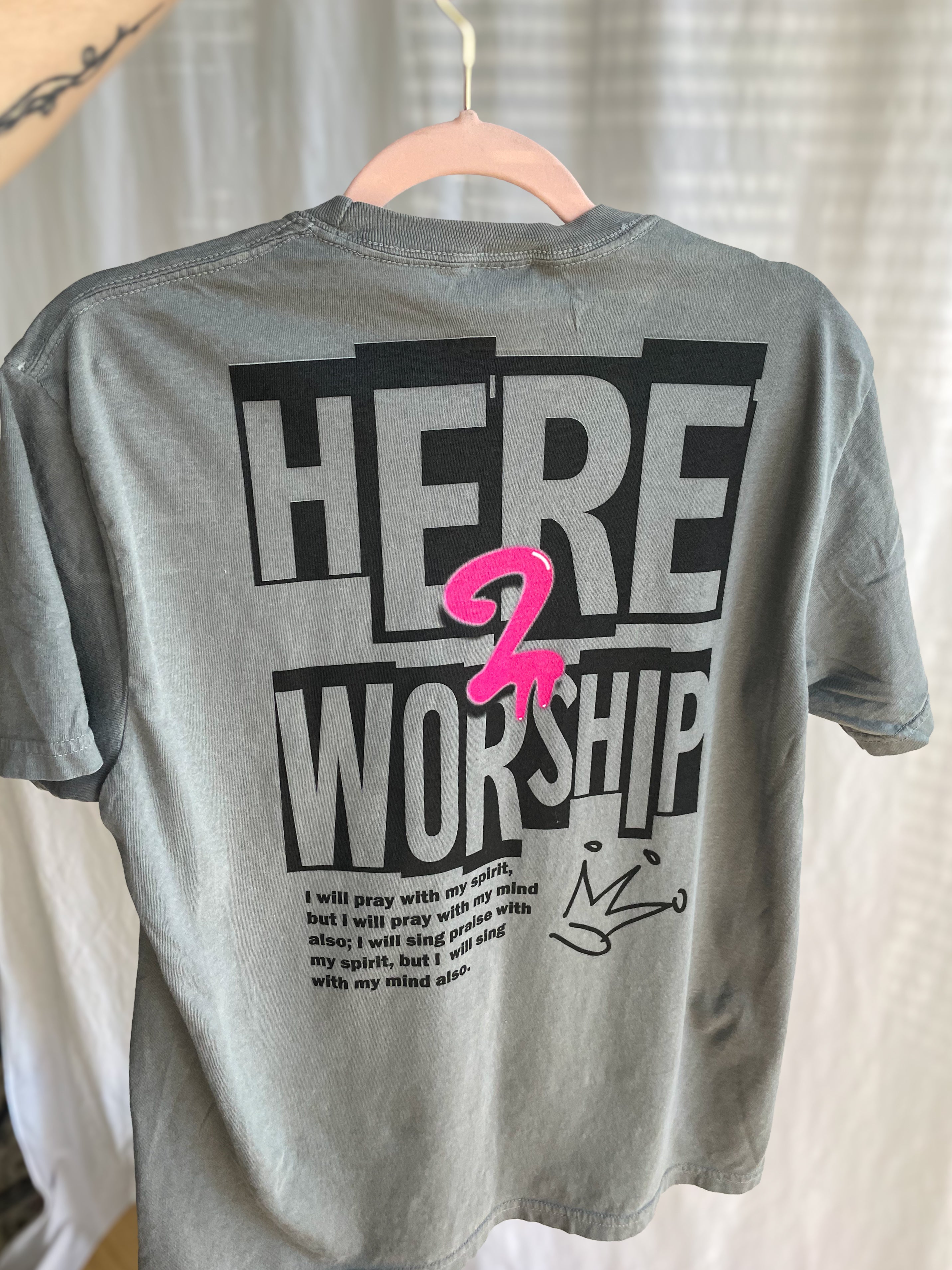 a t - shirt that says here is worship