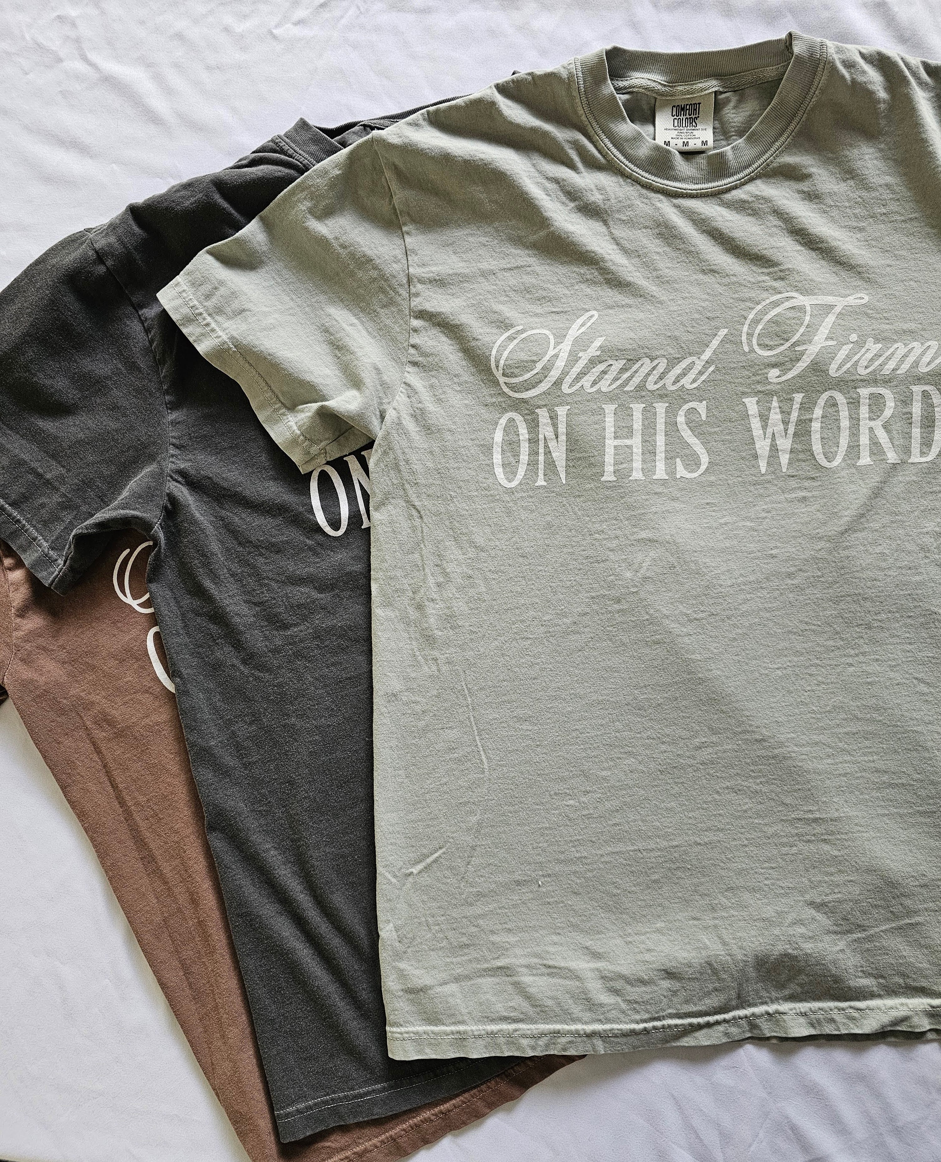 a couple of shirts that are on a bed