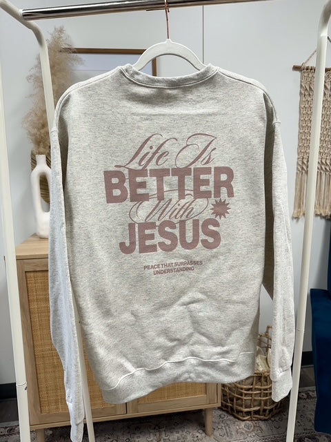 a sweatshirt that says life is better with jesus on it