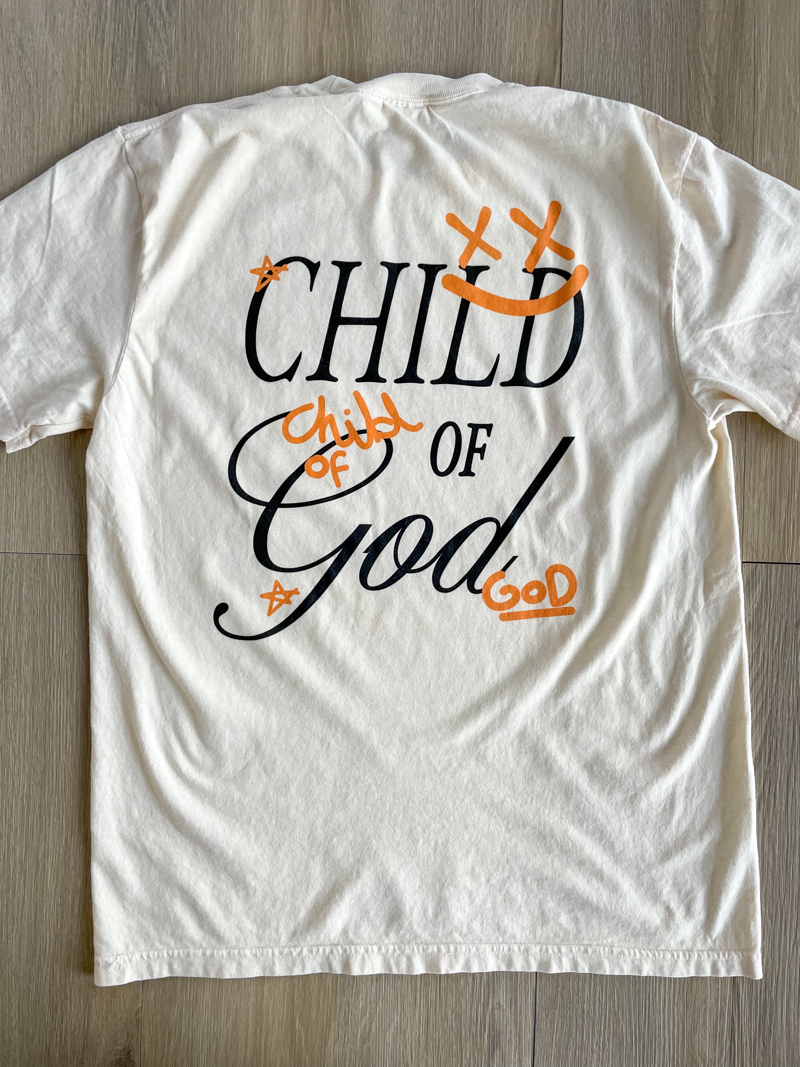 a t - shirt that says child of god on it