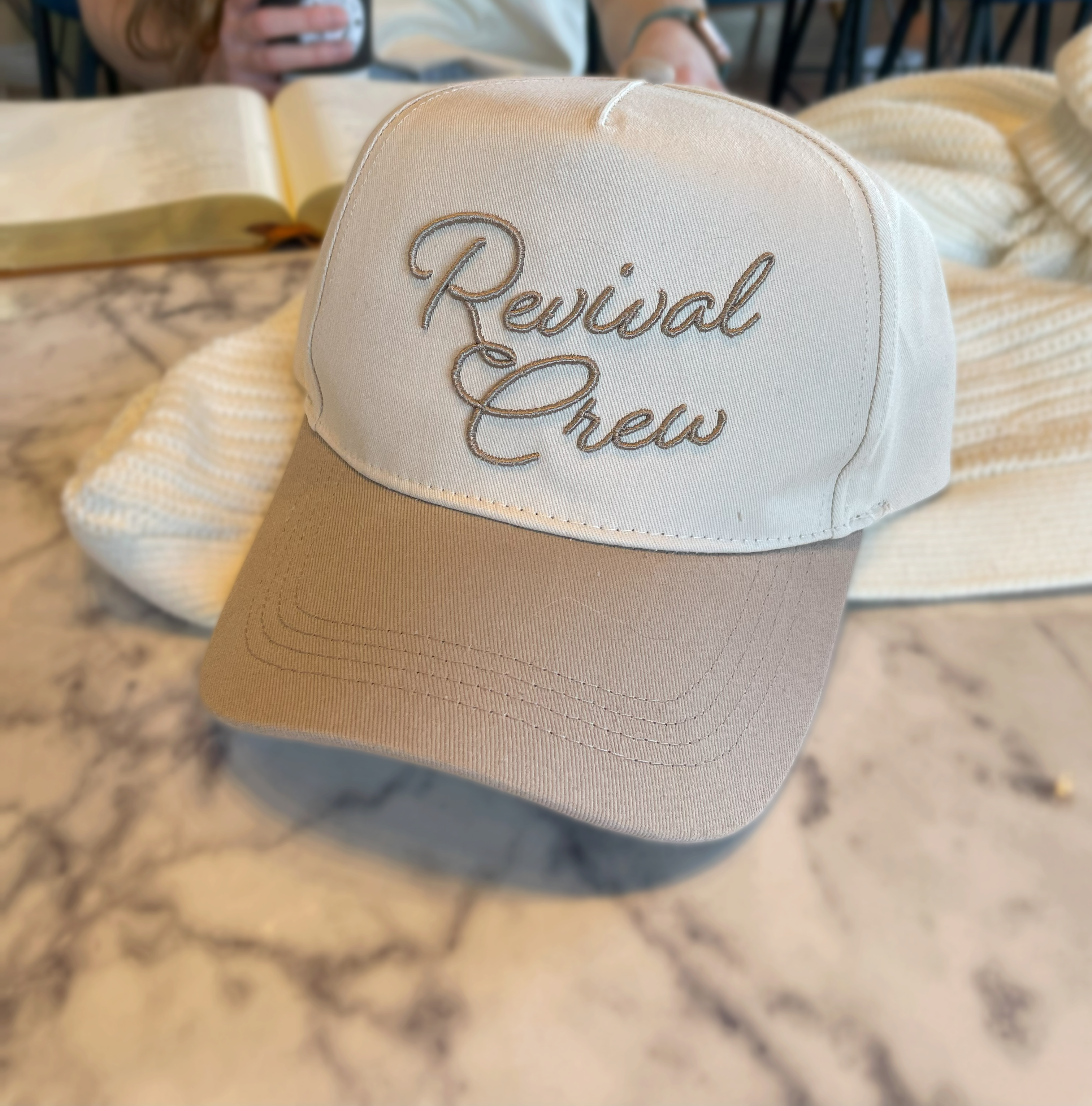 a hat that reads revival crew sitting on a table
