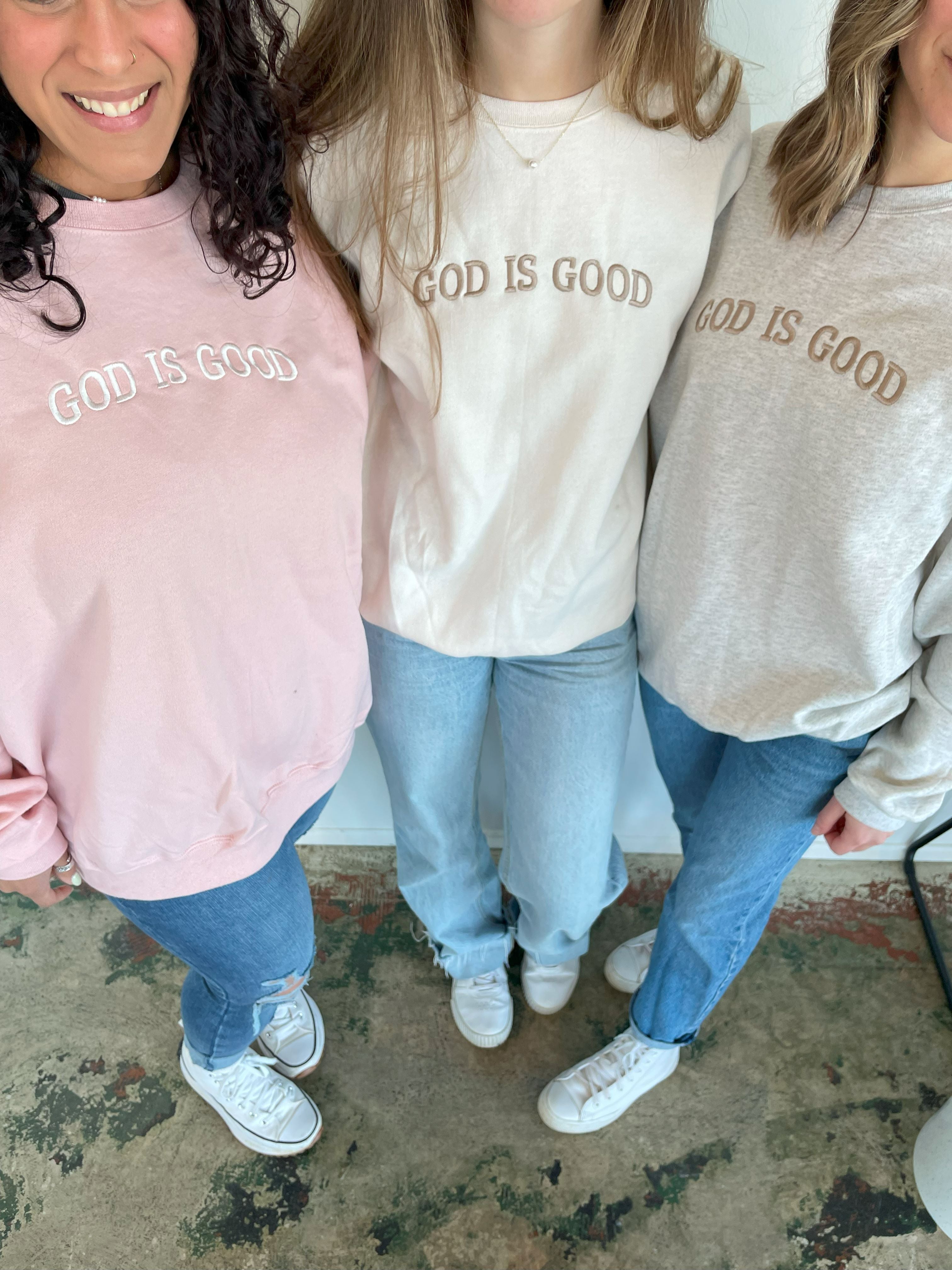 a group of three women standing next to each other