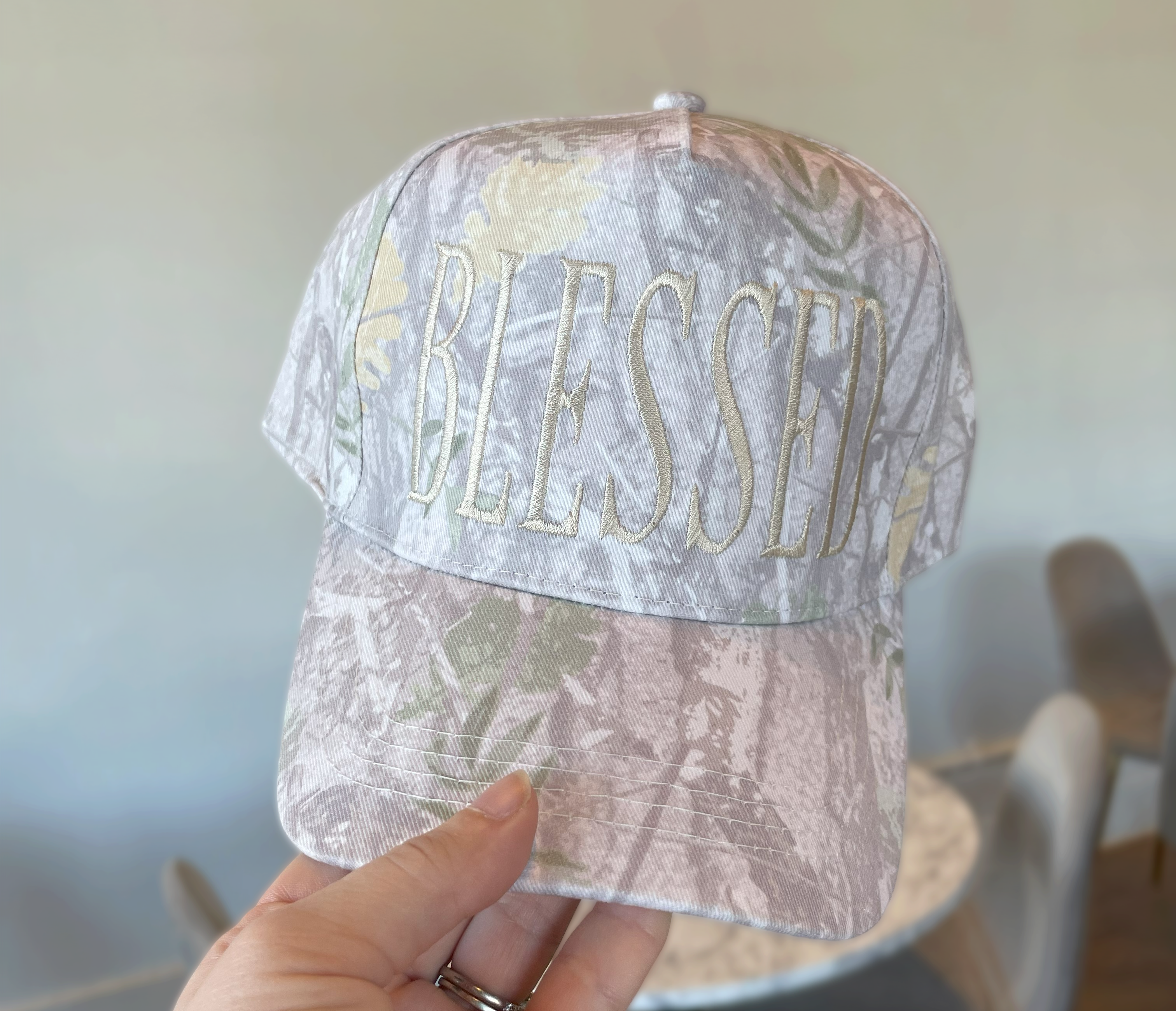 a person holding a hat with the word awesome on it