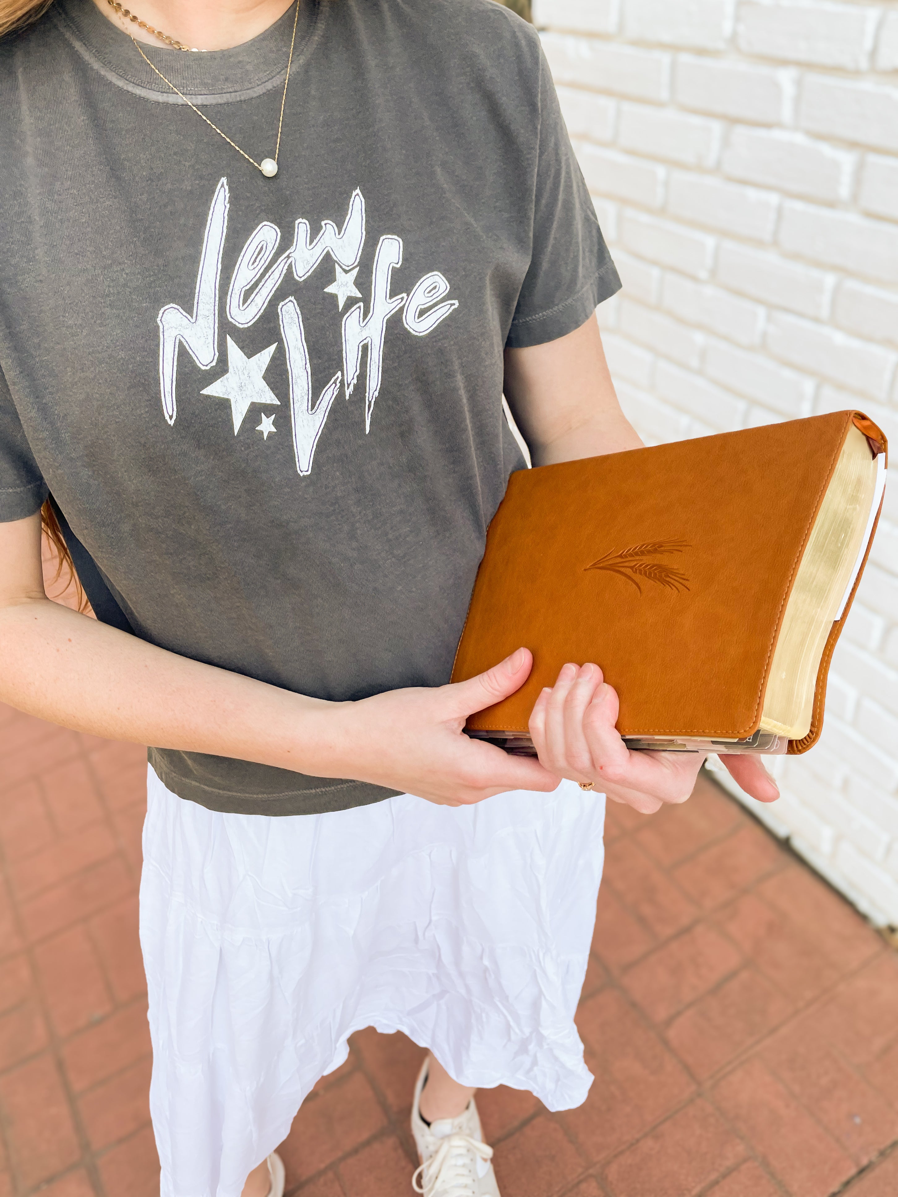 a woman holding a book in her hands