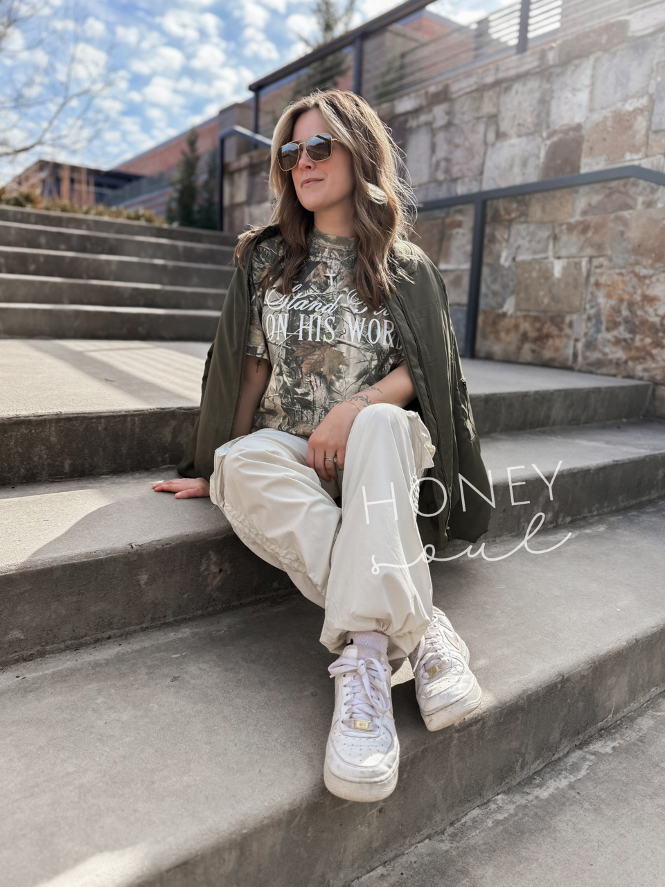 a woman sitting on the steps of a building