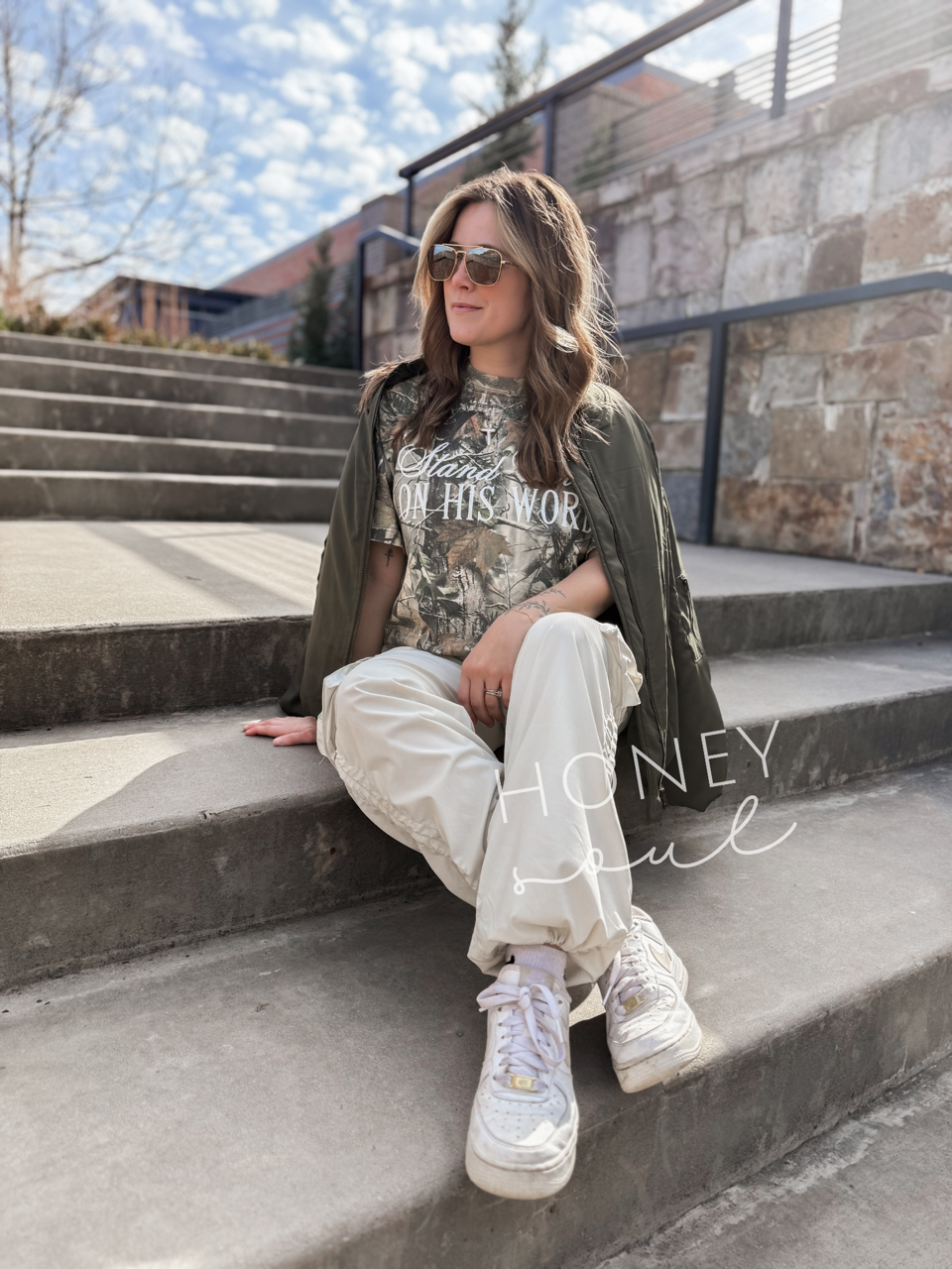 a woman sitting on the steps of a building