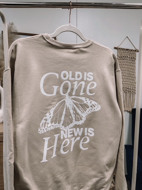 a sweatshirt with a picture of a butterfly on it