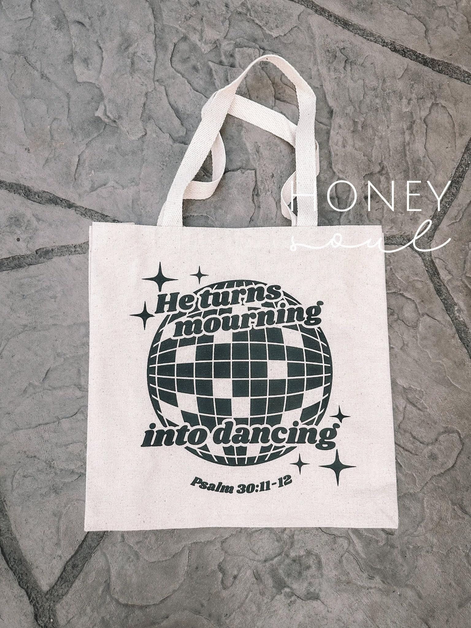 Mourning into Dancing Tote Bag
